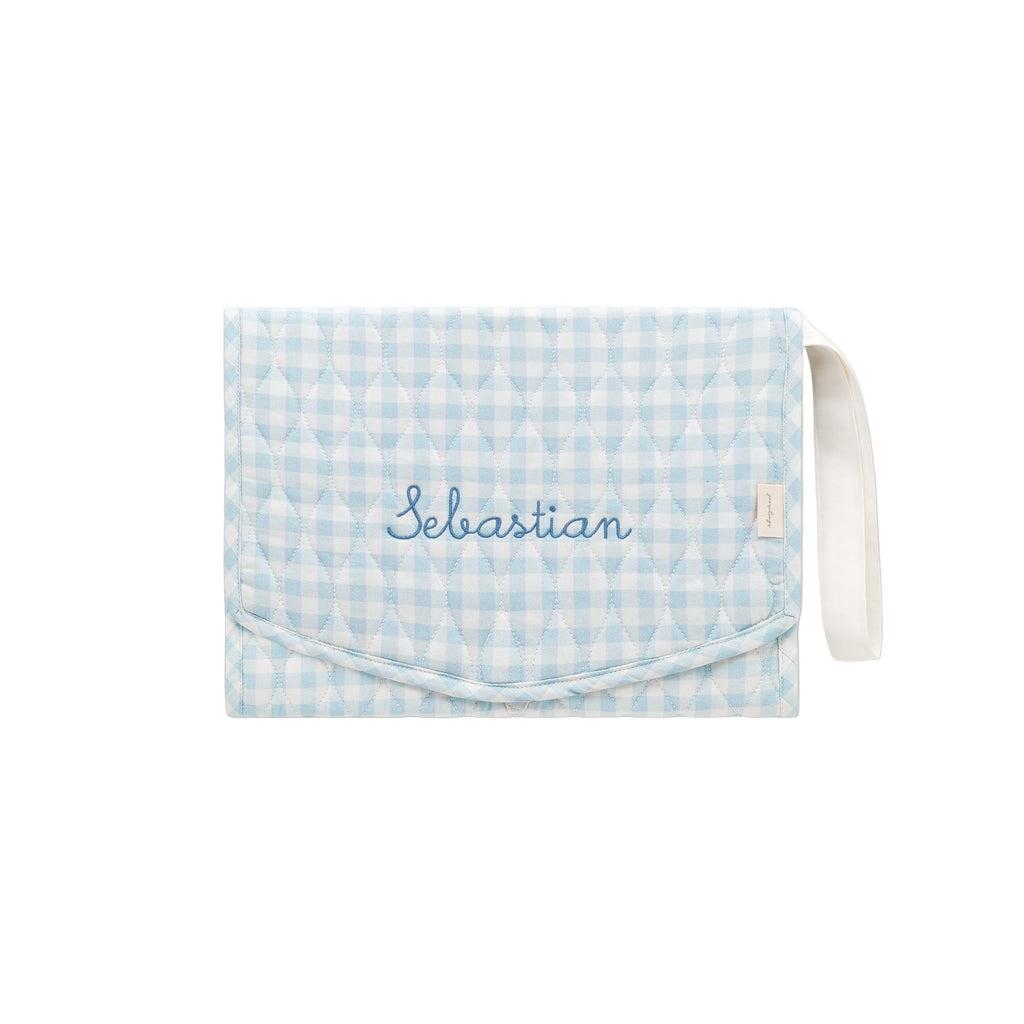 Portable Changing Pad in Blue Gingham with "Sebastian" embroidered on the front. 