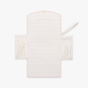 Portable Changing Pad in Pink Gingham. Inside is Ivory with pocket detail