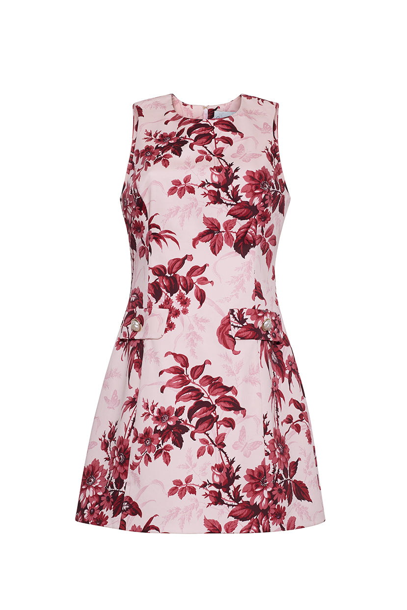Front view of Posie Dress in Windsor Blush, sleeveless A-line with red floral print and flap pockets on white background