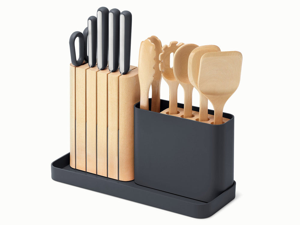 Three-quarter view of 14-piece knife and utensil set showcasing charcoal storage caddy, wooden knife block, and wooden utensils on white background