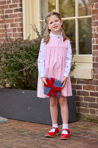 Little English classic children's clothing. White knit turtleneck with holiday present print layered under light pink corduroy Madison Jumper. Holiday outfit for little boys and girls.