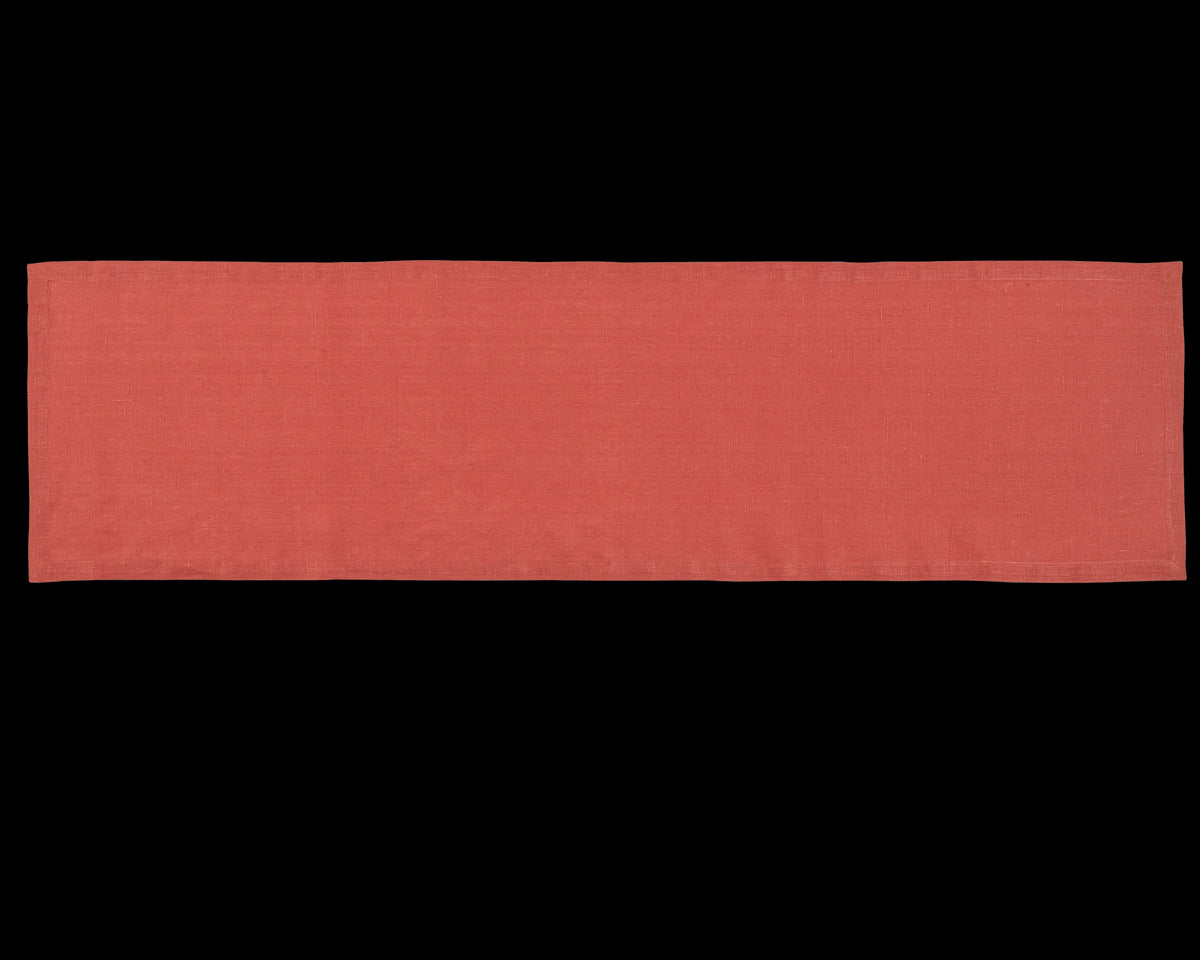 A linen table runner in the color brick