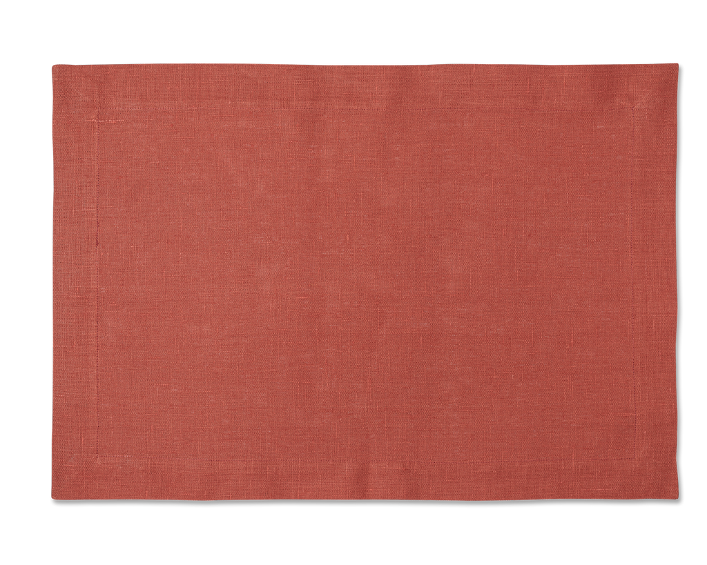 A linen placemat in the color brick