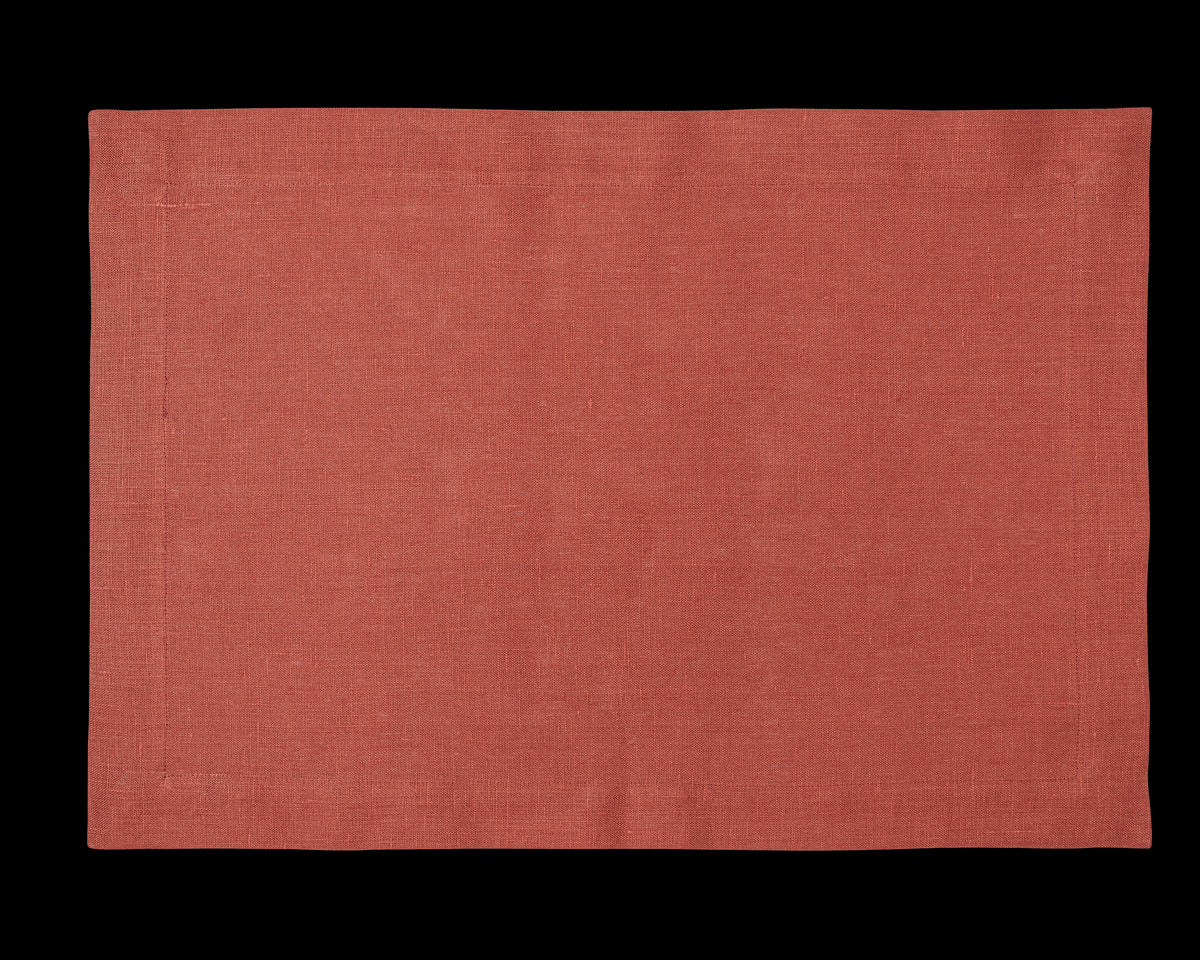 A linen placemat in the color brick