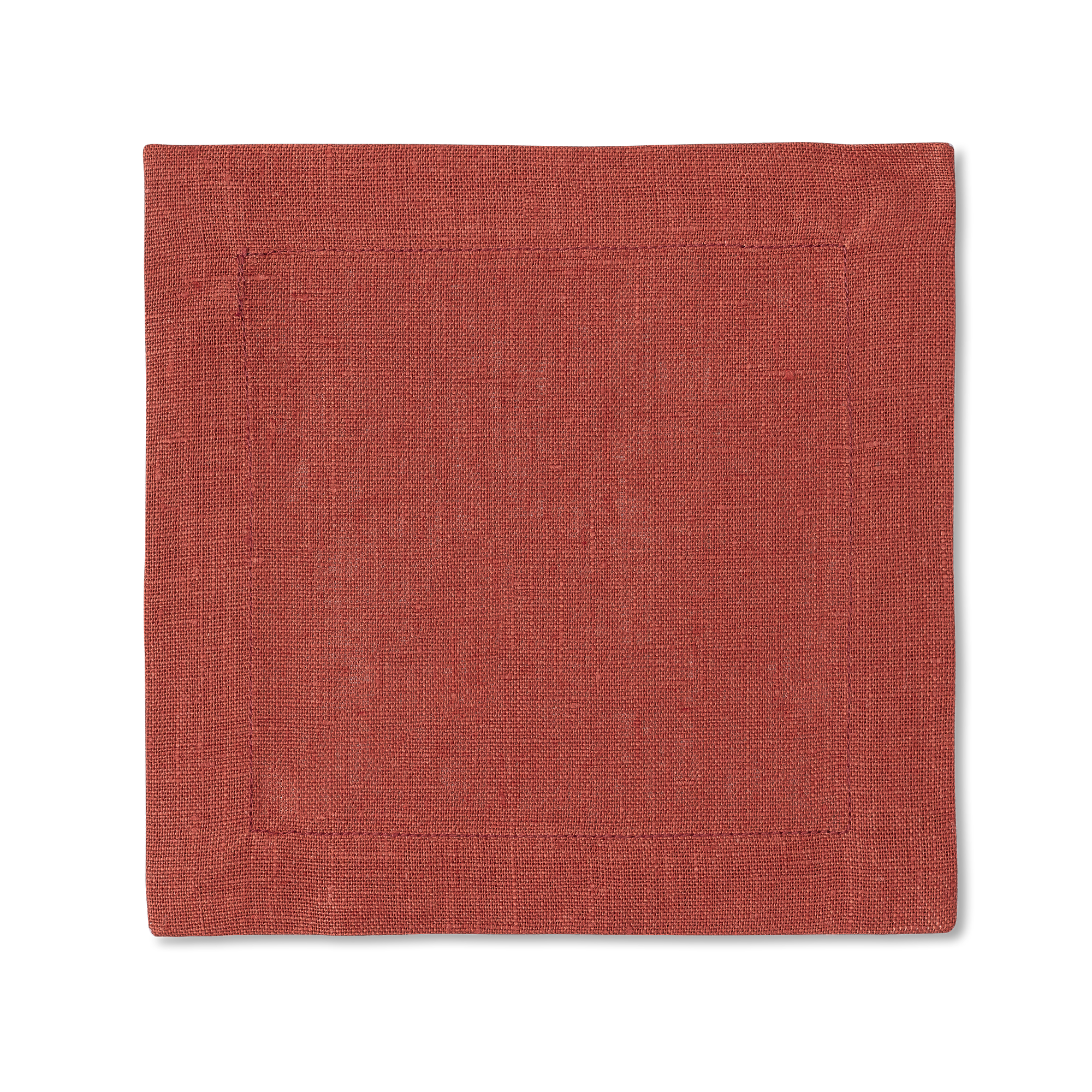 A square linen cocktail napkin in the color brick