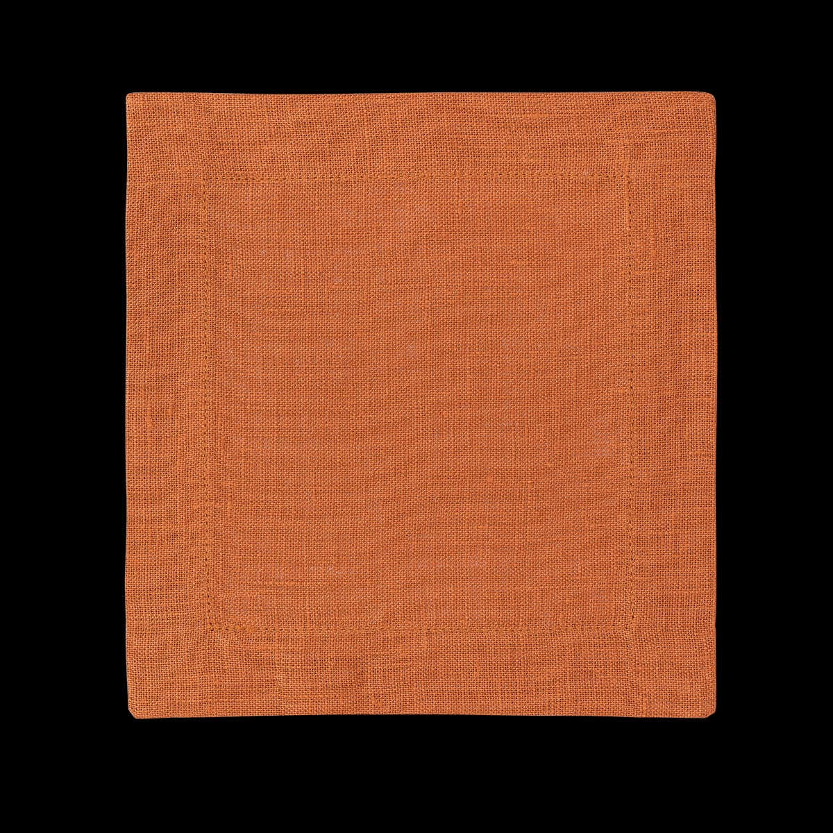 A square linen cocktail napkin in the color tangerine