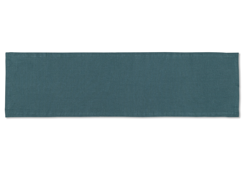 A linen table runner in the color peacock