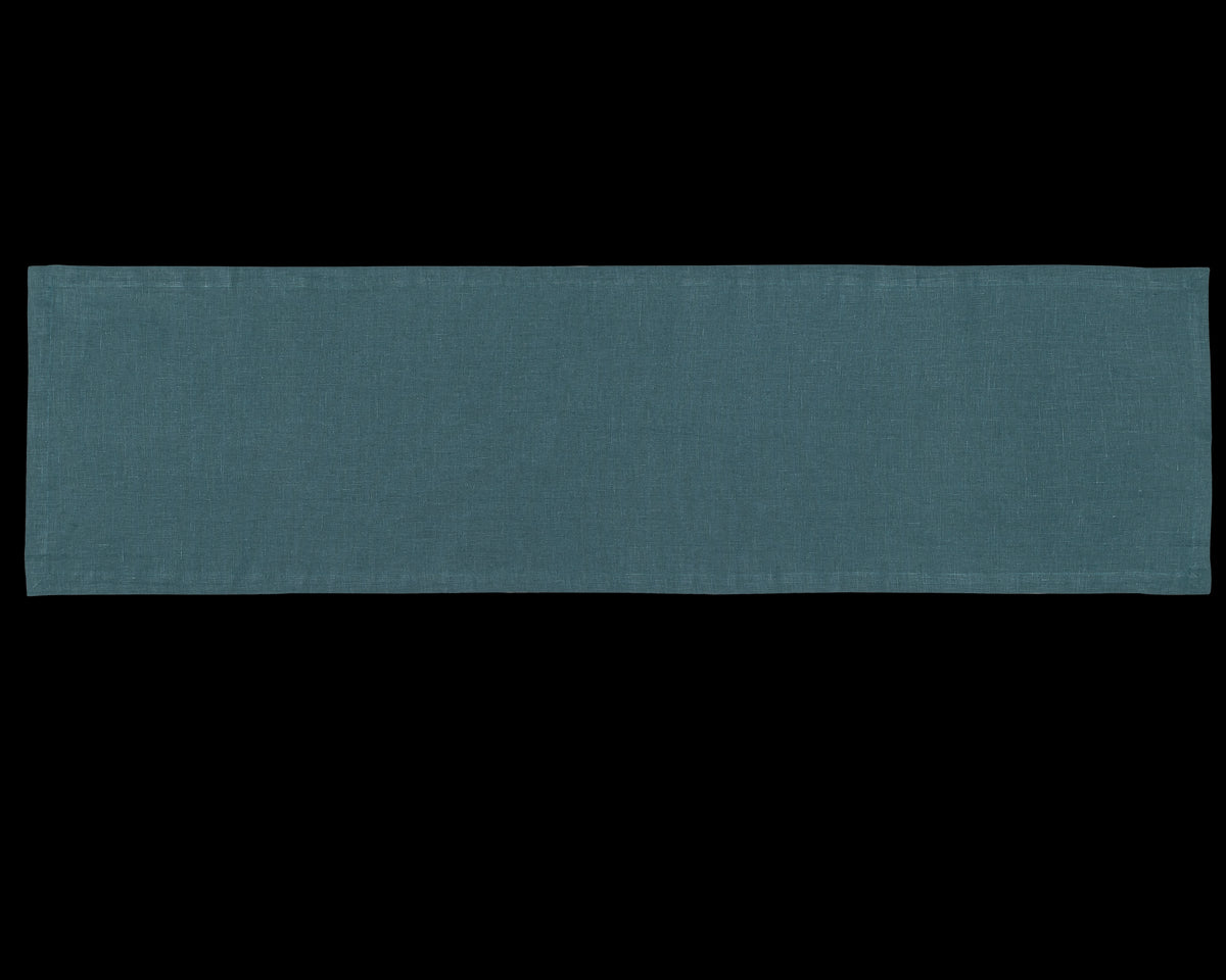 A linen table runner in the color peacock