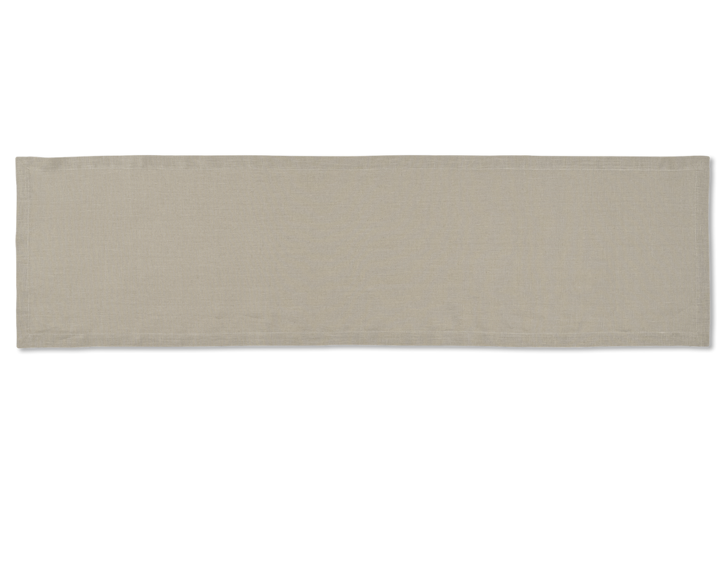 A linen table runner in the color sand