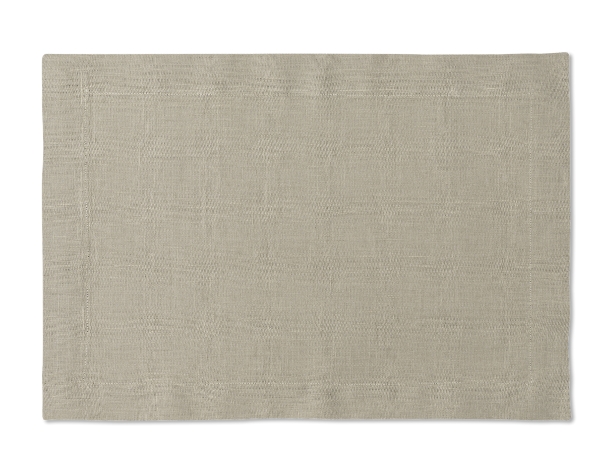 A linen placemat in the color sand