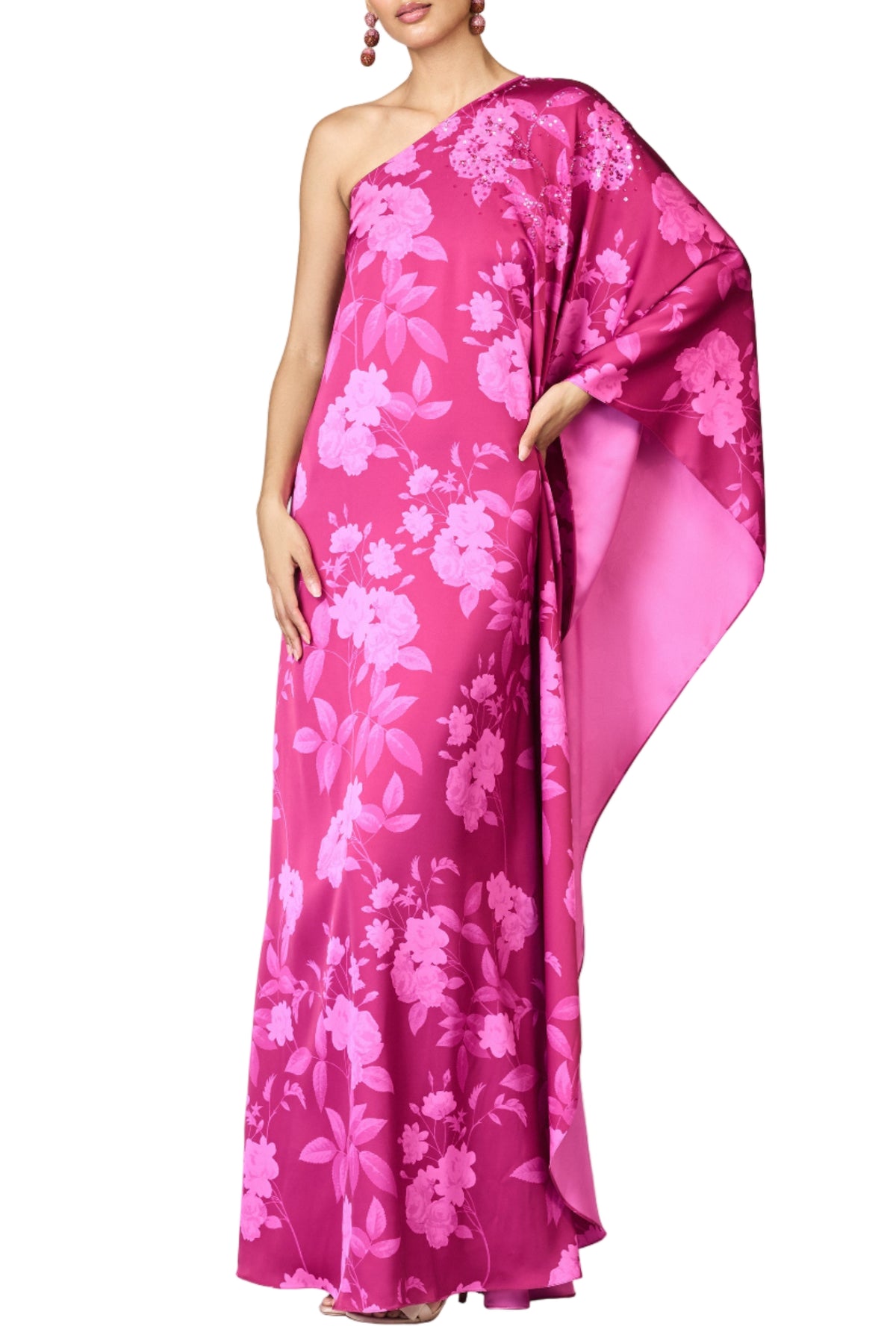Front of Embellished Demi Gown in Rhodolite Roses showing one-shoulder cut, cascading drape and hand embellishment on white