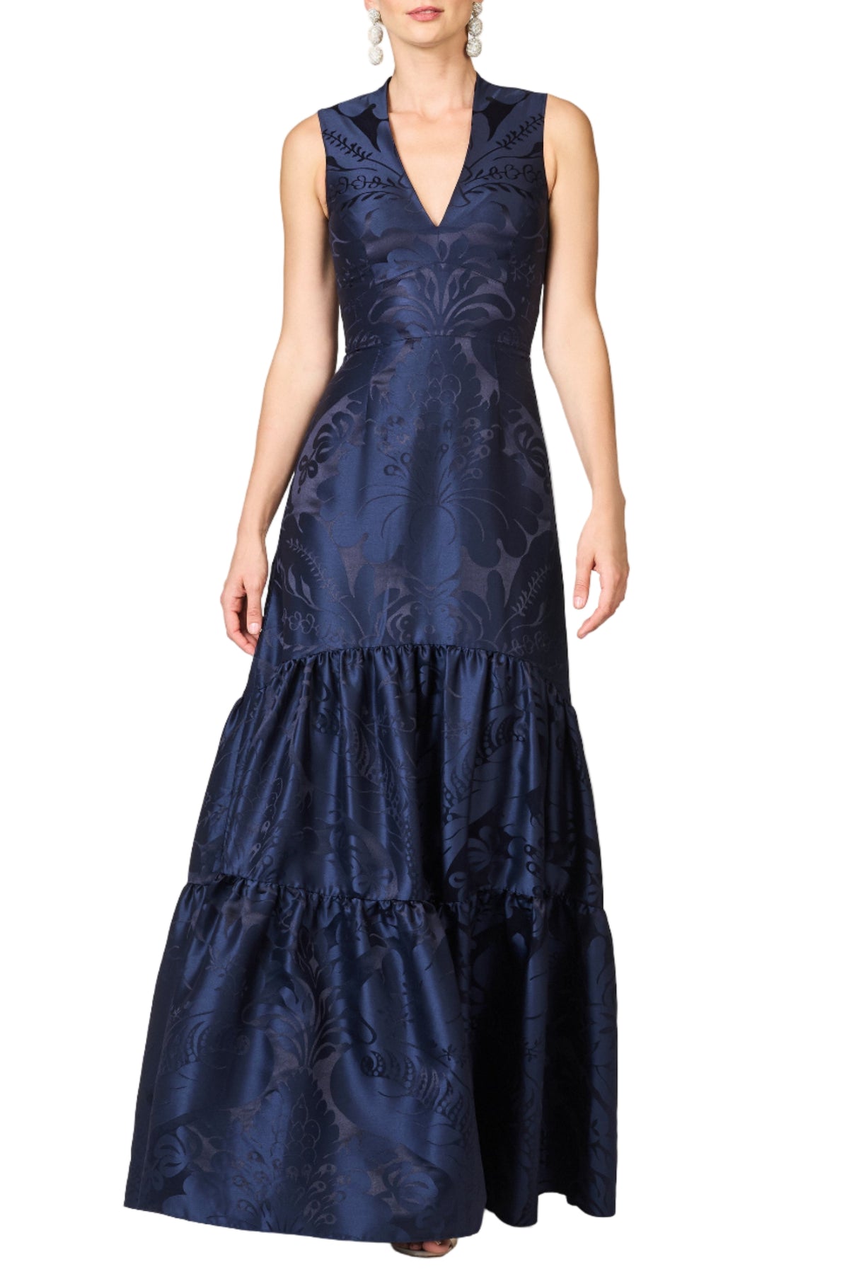 Front view of Cella Gown in Deep Ocean showing sleeveless V-neck bodice, fitted waist and tiered floral-damask skirt on white