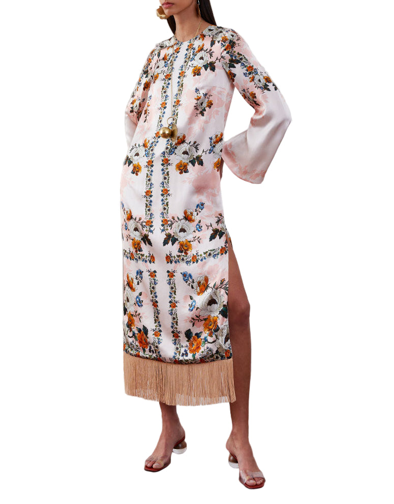 Three-quarter view of Seraphina crepe midi dress in Magical Blossom Pink with flared sleeves, side slit and fringe hem