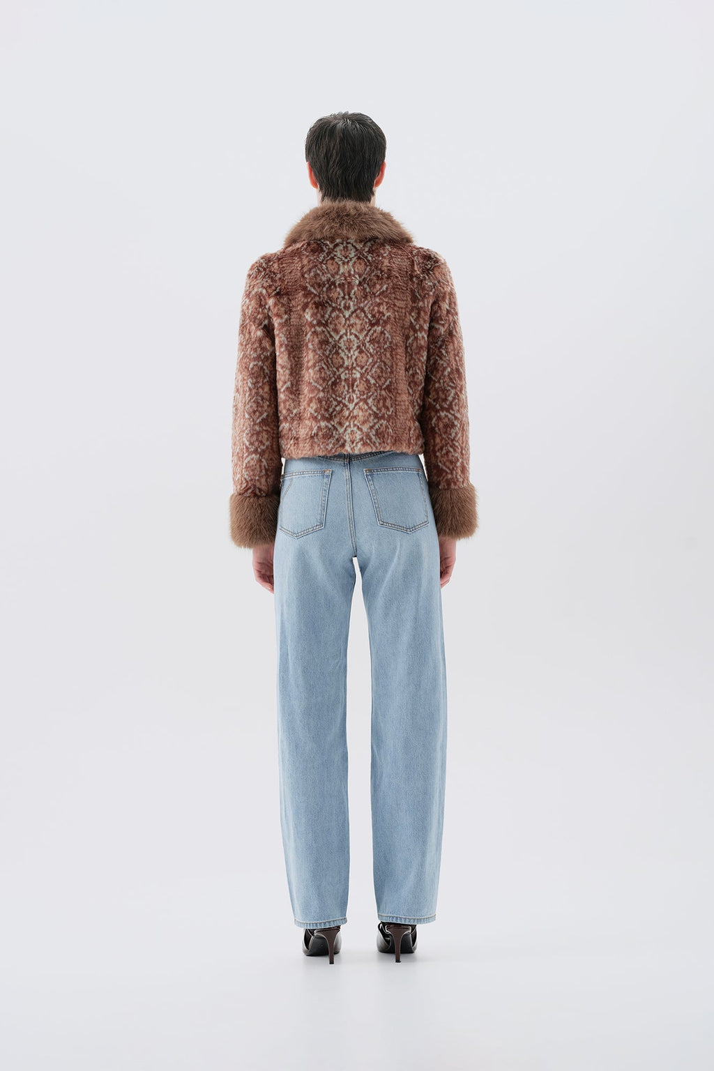 Cropped brown patterned faux fur jacket, fur trim collar and cuffs, back view