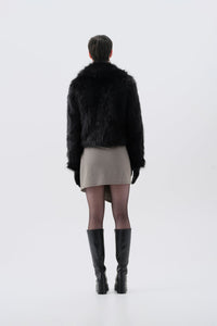 Cropped black faux fur jacket, back view