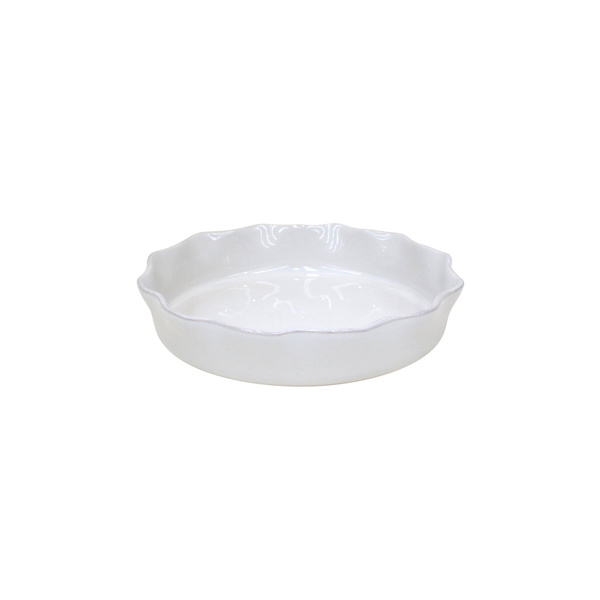 Angled view of Costa Nova Cook & Host pie dish showcasing fluted rim and glossy finish on white background