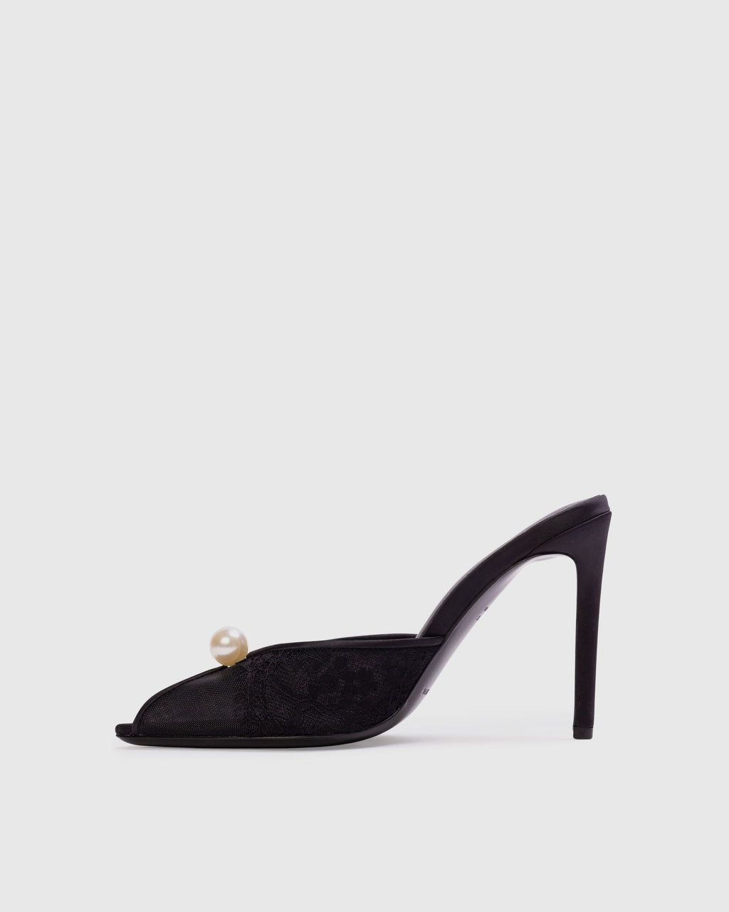 <p>The Debby 100 Mule in Black Mesh with Pearl Ornament