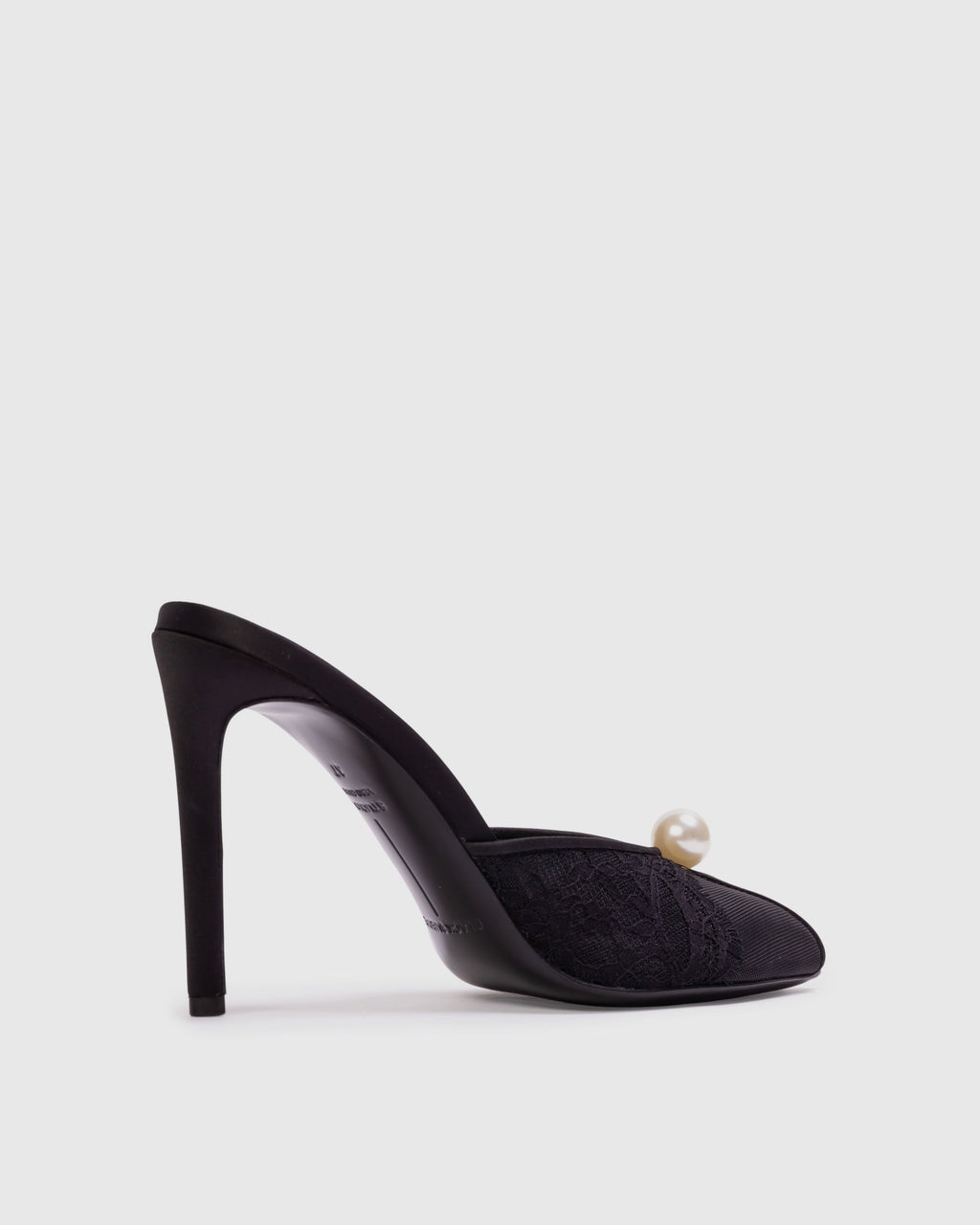 <p>The Debby 100 Mule in Black Mesh with Pearl Ornament