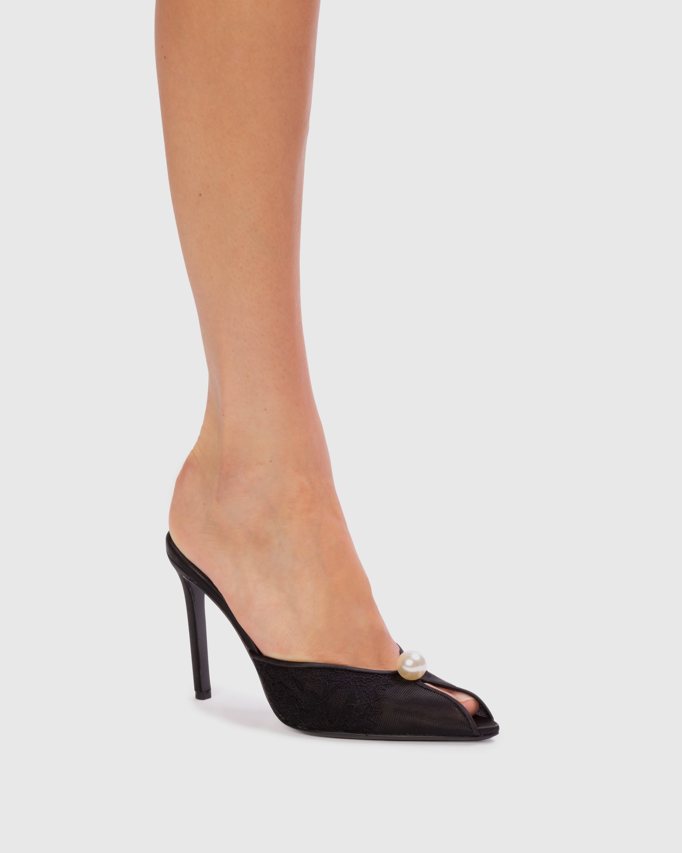 <p>The Debby 100 Mule in Black Mesh with Pearl Ornament
