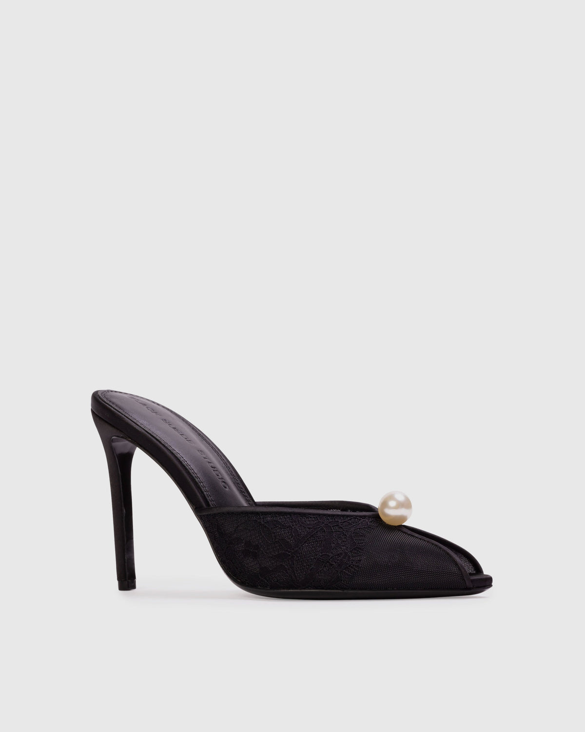 <p>The Debby 100 Mule in Black Mesh with Pearl Ornament