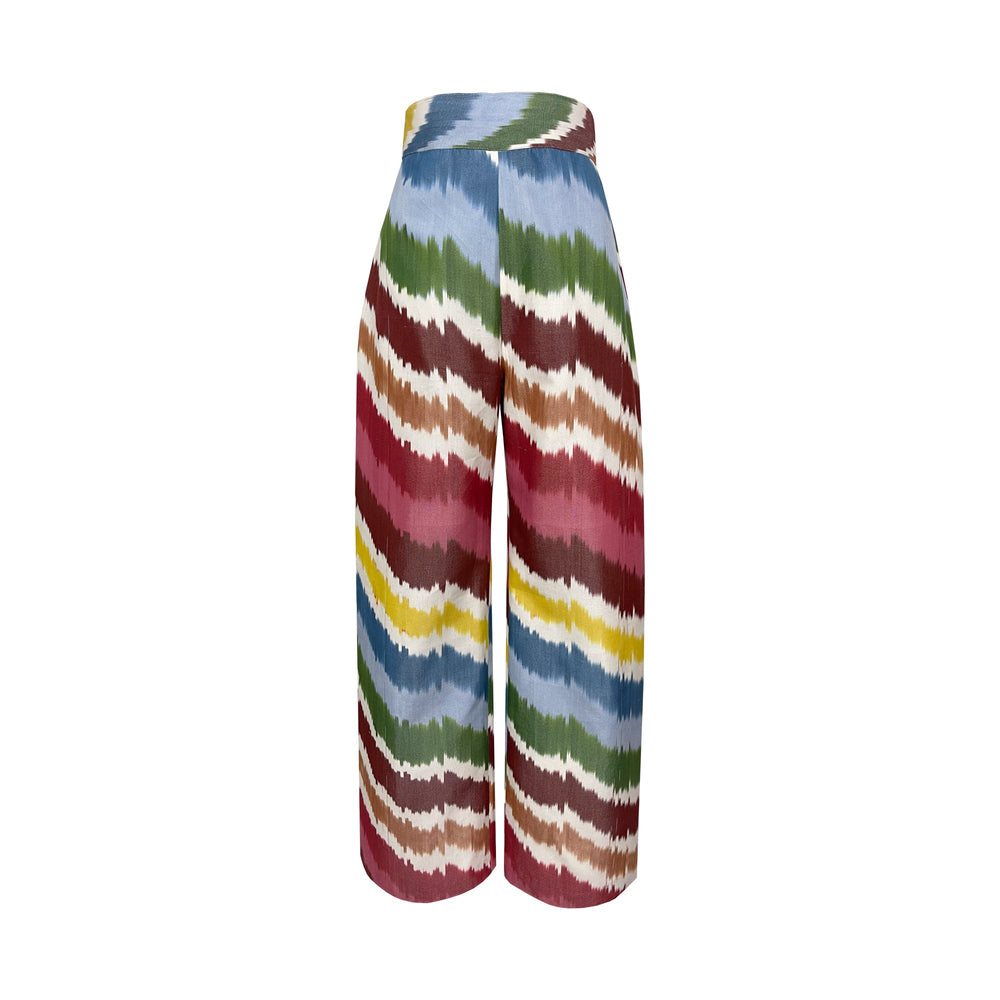Front view of Rainbow Trousers showcasing a high-waisted, slightly A-line silhouette and multicolor ikat pattern on white background