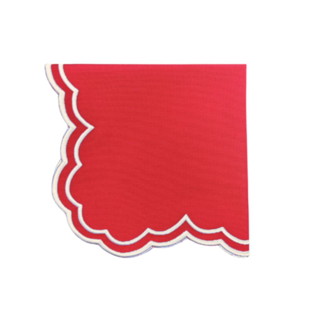 Red scalloped cloth napkin and white embroidery