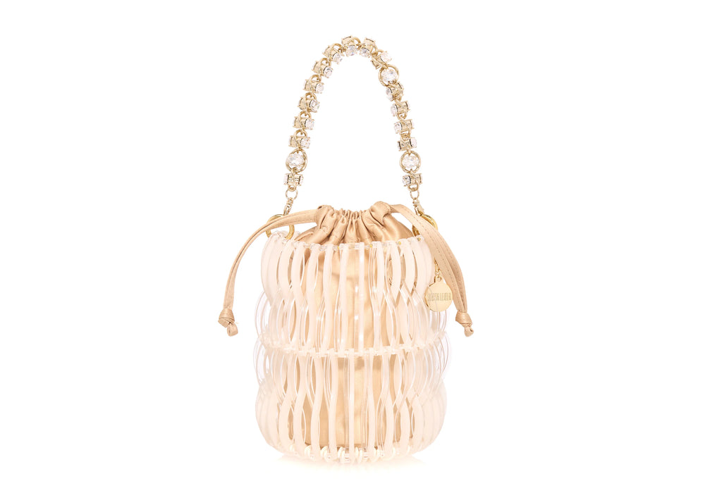 Front view of Harper Pearly bucket bag with clear woven resin pearled exterior, satin drawstring pouch and jeweled handle