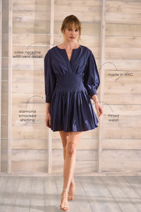 Navy diamond-smocked novelty shirting fabric with a soft V effect and blouson sleeves.