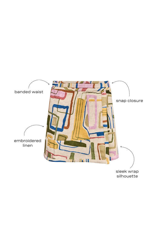 Skirt with a banded waist and sleek wrap silhouette with discreet snap closure.