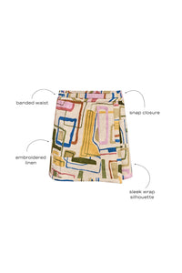 Skirt with a banded waist and sleek wrap silhouette with discreet snap closure.