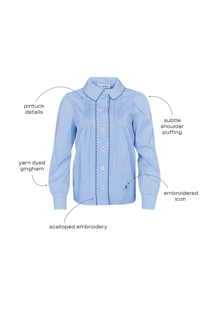 Blue and white gingham button down with a button front placket, shoulder puffing, and pintuck detail