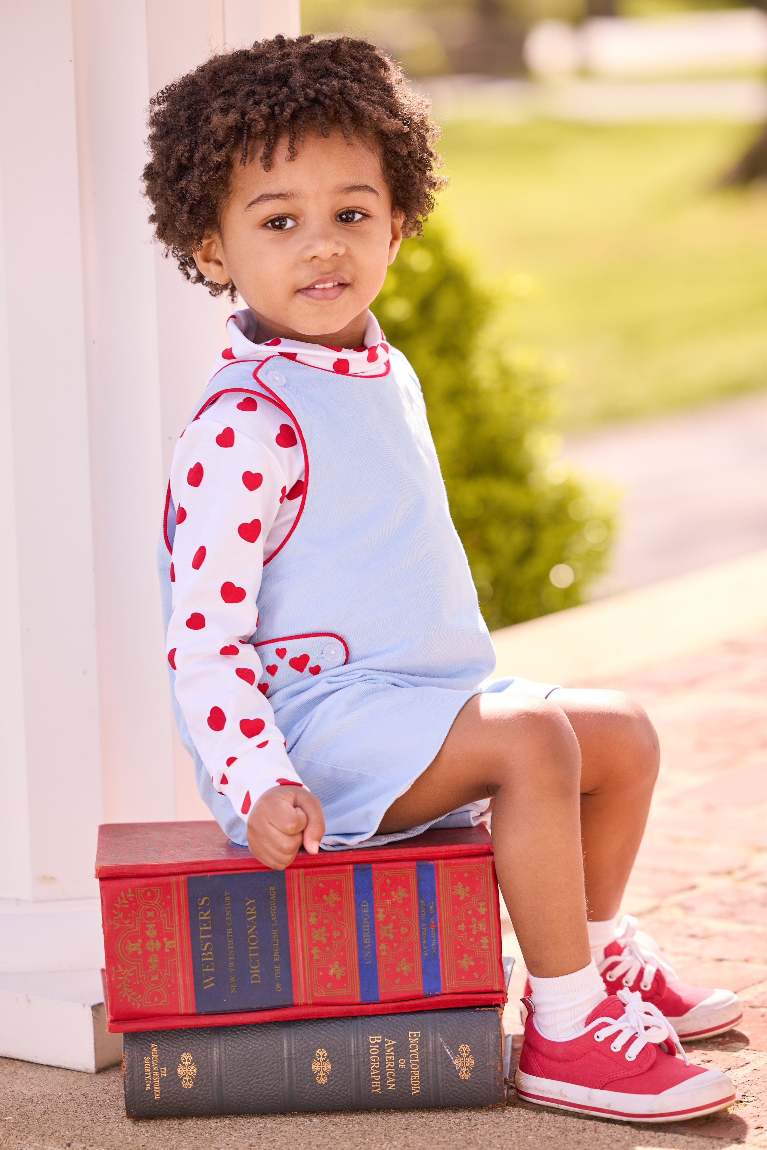 Little English, toddler boy's light blue John John with red piping and embroidered red hearts at the side tabs, printed turtleneck with heart pattern, outfit for Valentines