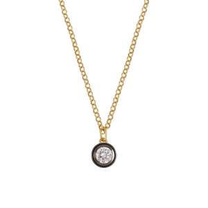 Front view of Rhodium Bezel Charm Necklace showcasing a round bezel-set charm with a clear stone on a white background