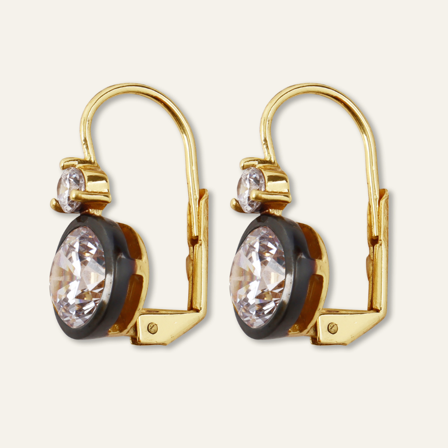 Front view of Rhodium Double Bezel Drop Earrings showcasing oval faceted stones with a light background