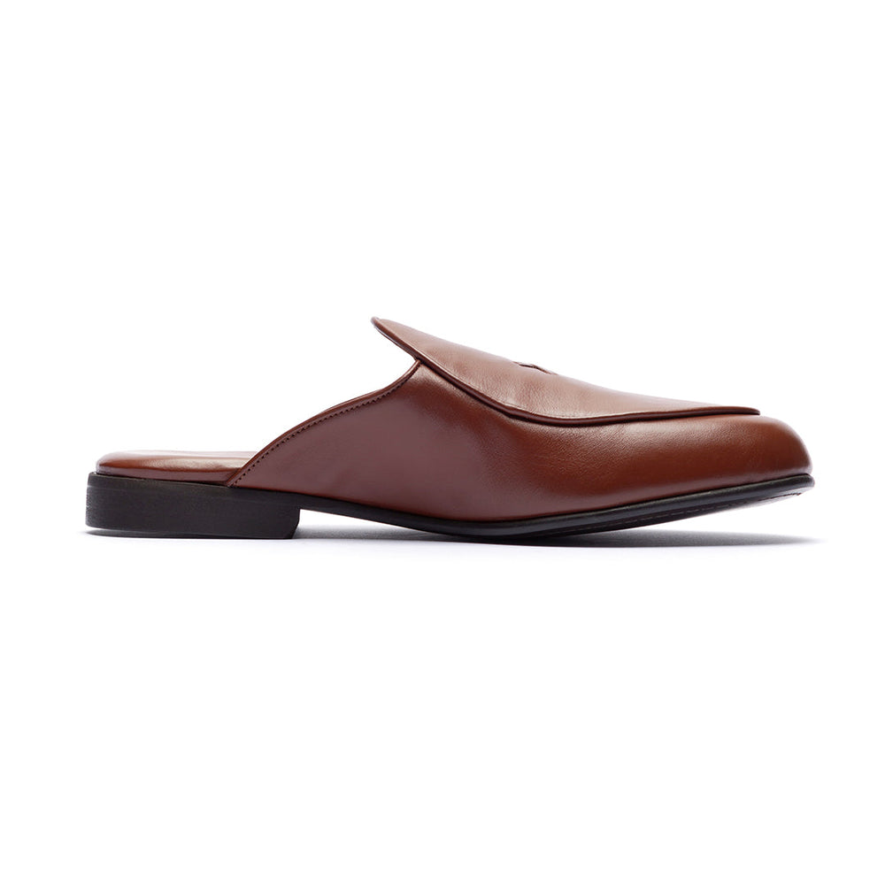 Side view of Brown Leather Milano Mule showcasing its backless heel and brown leather upper on a white background