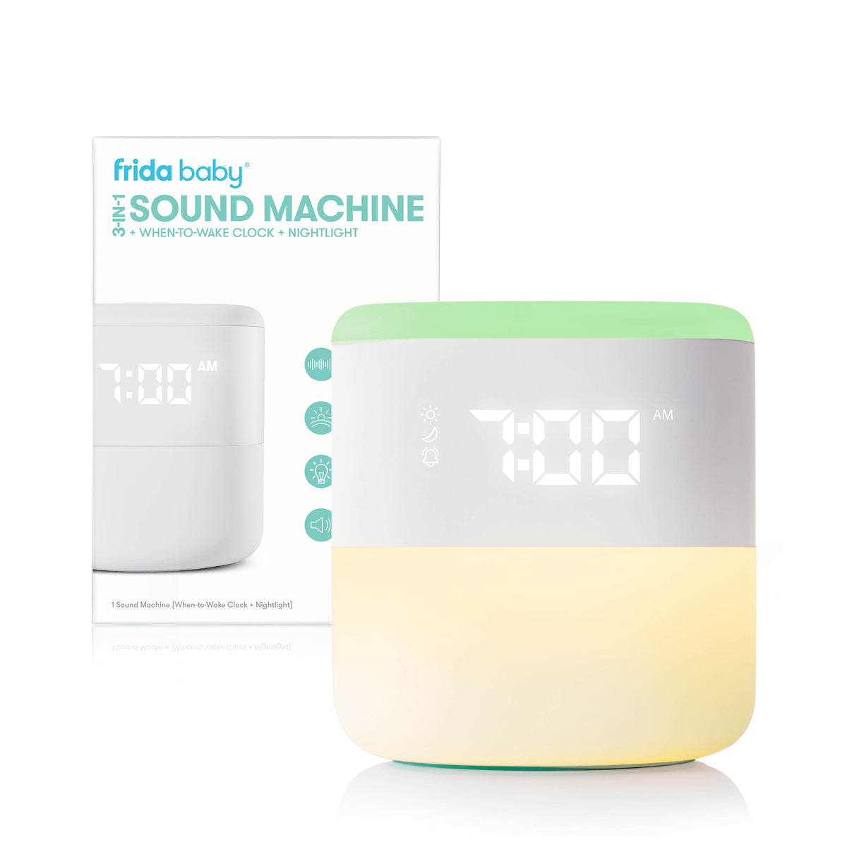 Front view of Frida Baby 3-in-1 sound machine showing digital 7:00 display, green when-to-wake light, and warm nightlight glow
