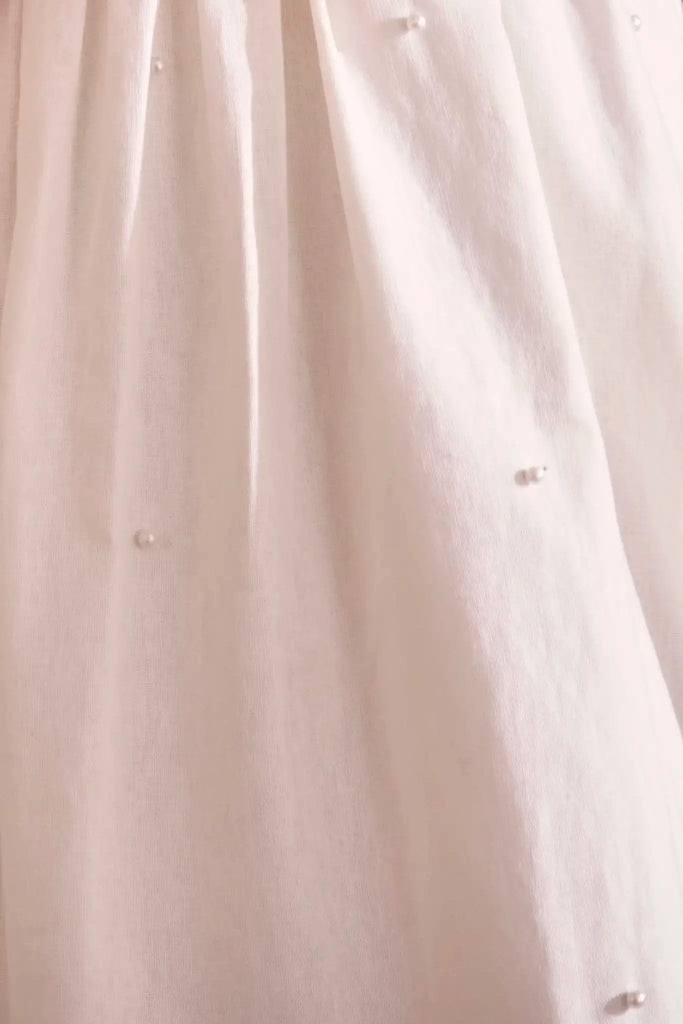 Ivory cotton-linen pearl embellished maxi dress with slim spaghetti straps and optional tie waist.