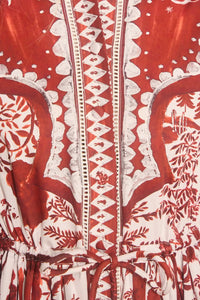 The Rosie Dress is full-length, collared neckline, long sleeve with button cuffs, & drawstring waist