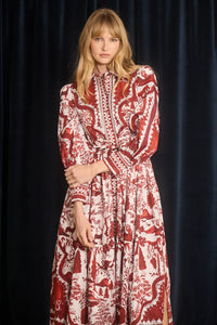 The Rosie Dress is full-length, collared neckline, long sleeve with button cuffs, & drawstring waist