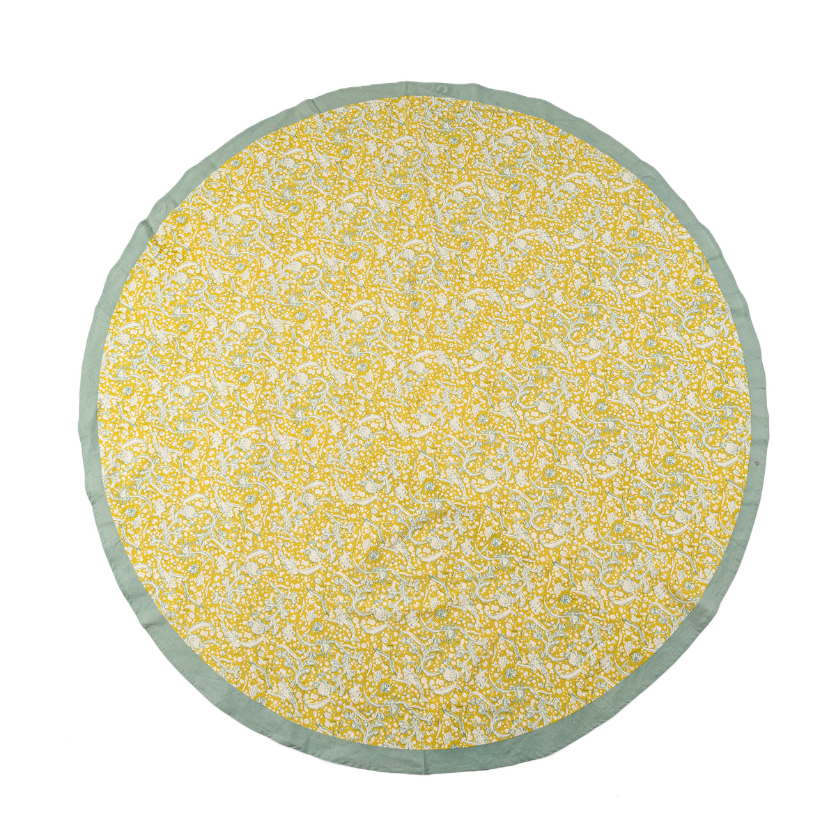 Close view of French Tablecloth La Mer showcasing aqua border and citrine fanciful creature pattern on white background