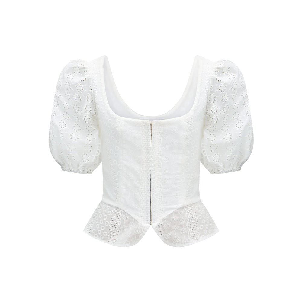 Front view of Roya Bodice in White Eyelet showcasing broderie anglaise cotton, puff sleeves, and peplum hem on white background