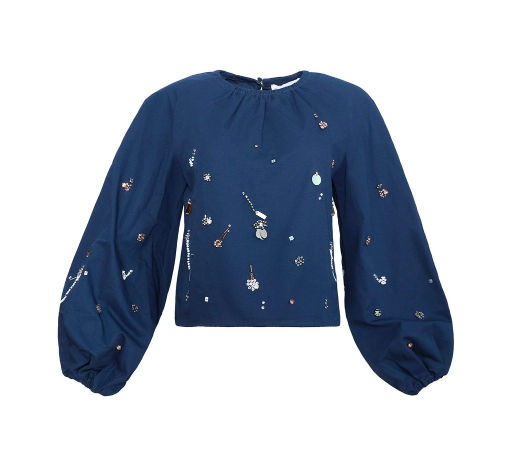 Front view of Rue Top in Atelier Splatter Navy showcasing scattered hand embellishments and elastic cuffs with a white background
