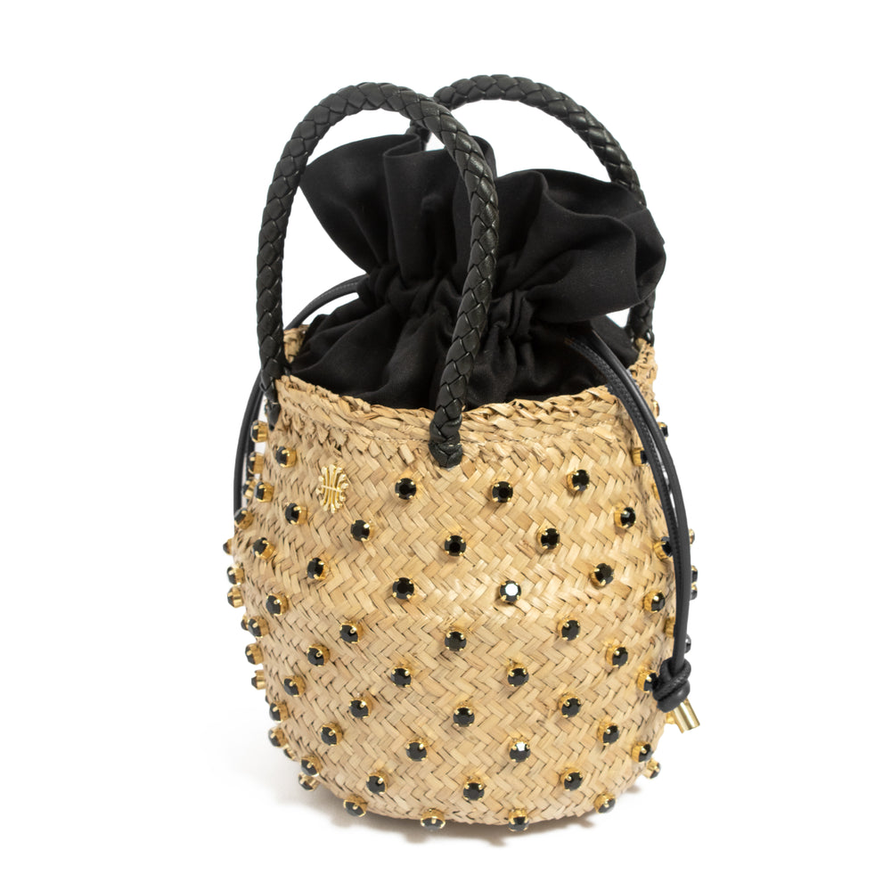 Nina Double Cotton basket bag, angled view: seagrass weave, black drawstring lining, braided handles, crystal studs on white