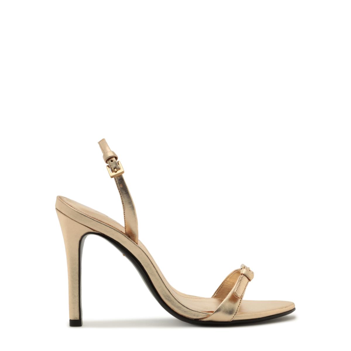 Side view of Aurora Sling Metallic Sandal in Platinum showcasing slingback strap and high stiletto heel on white background