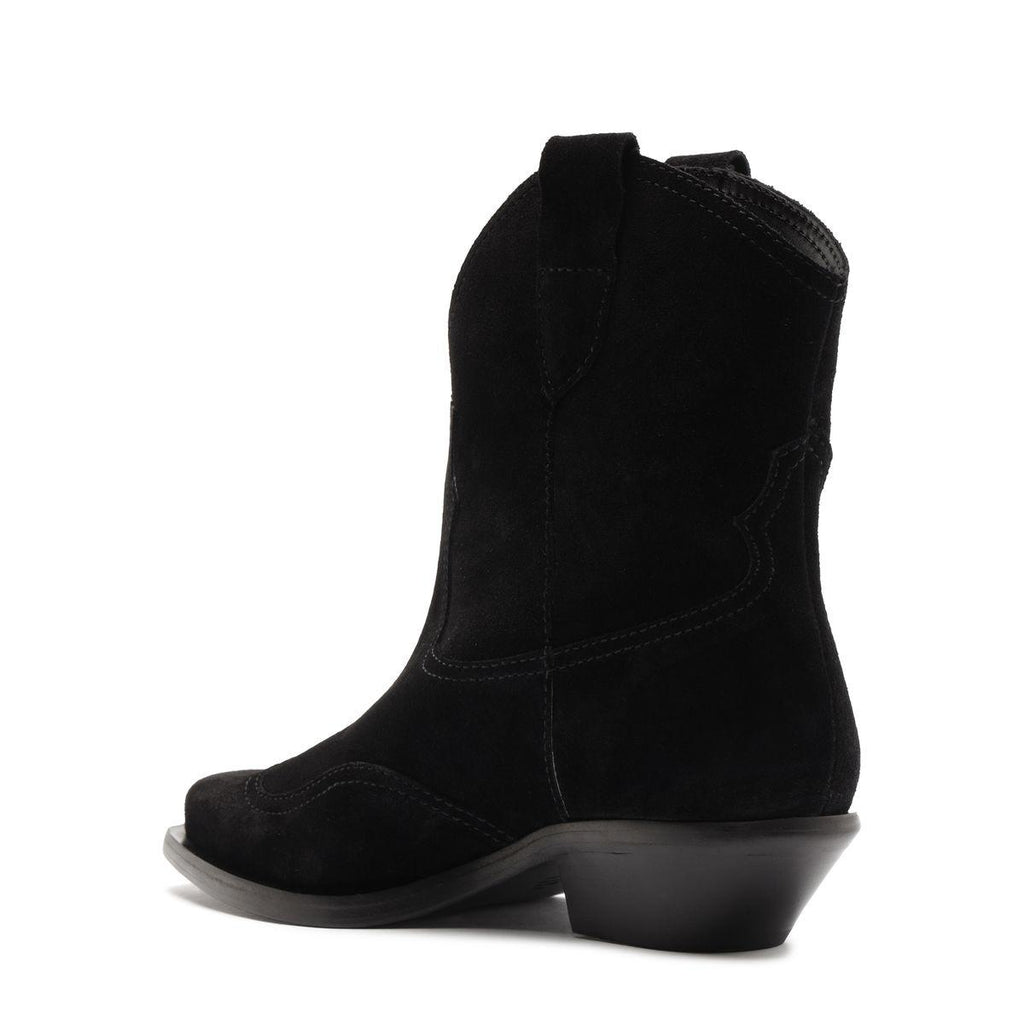 Side view of Nash suede bootie in black showcasing pointed toe and low block heel with a white background