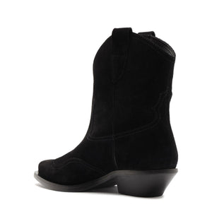 Side view of Nash suede bootie in black showcasing pointed toe and low block heel with a white background