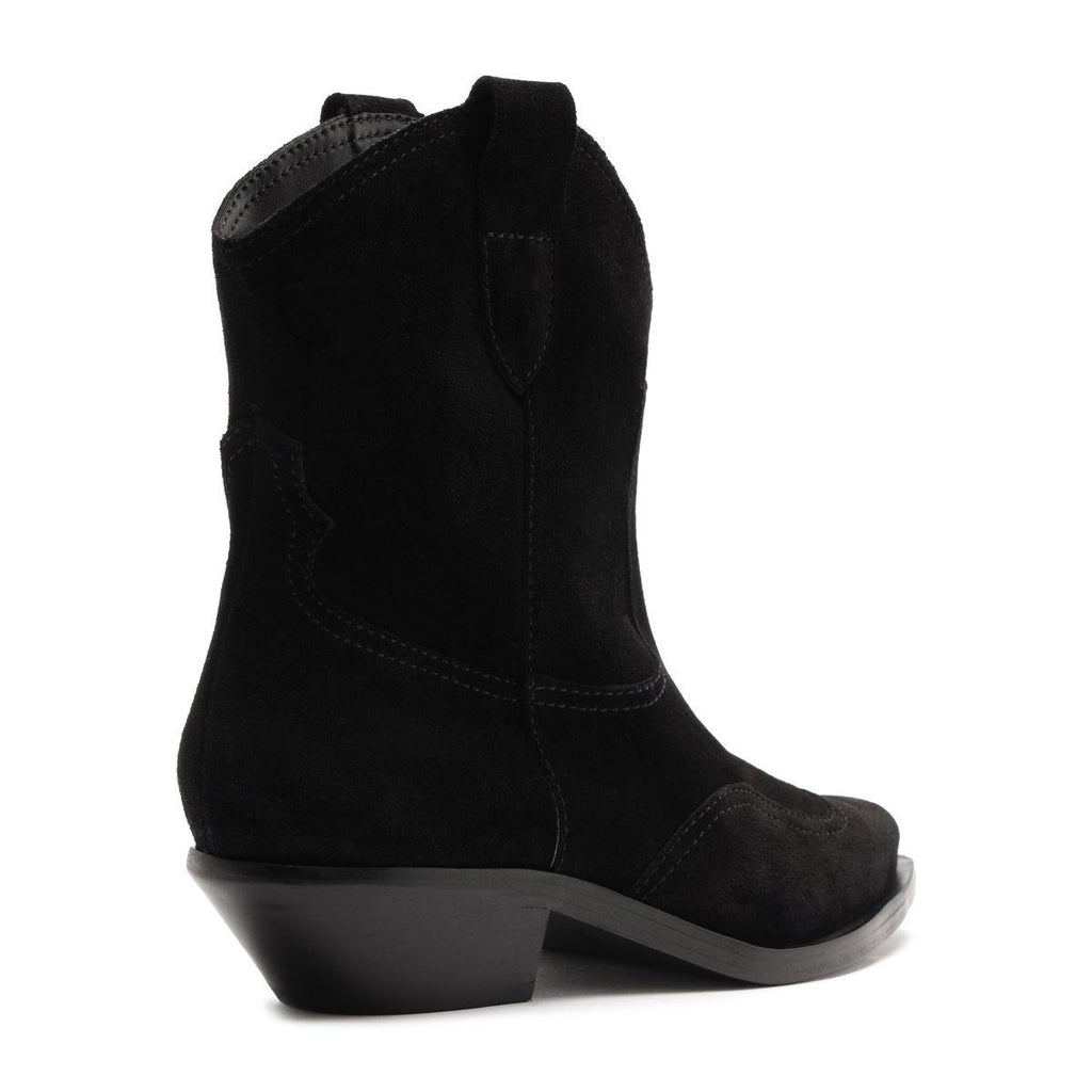 Side view of the Nash Suede Bootie in black showcasing its pointed toe and low block heel with a white background