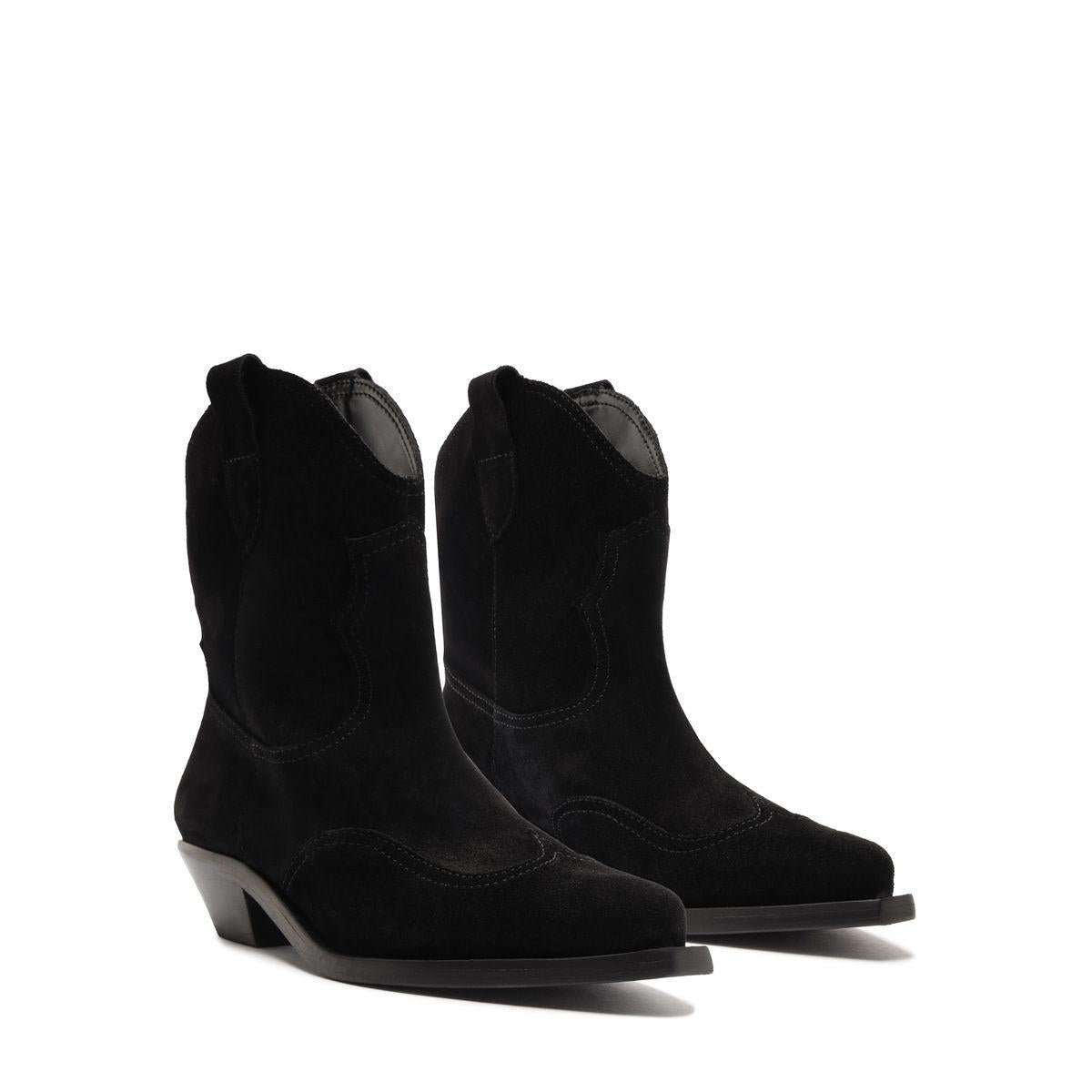Three-quarter view of Nash Suede Bootie in Black showcasing pointed toes and low block heels on a white background