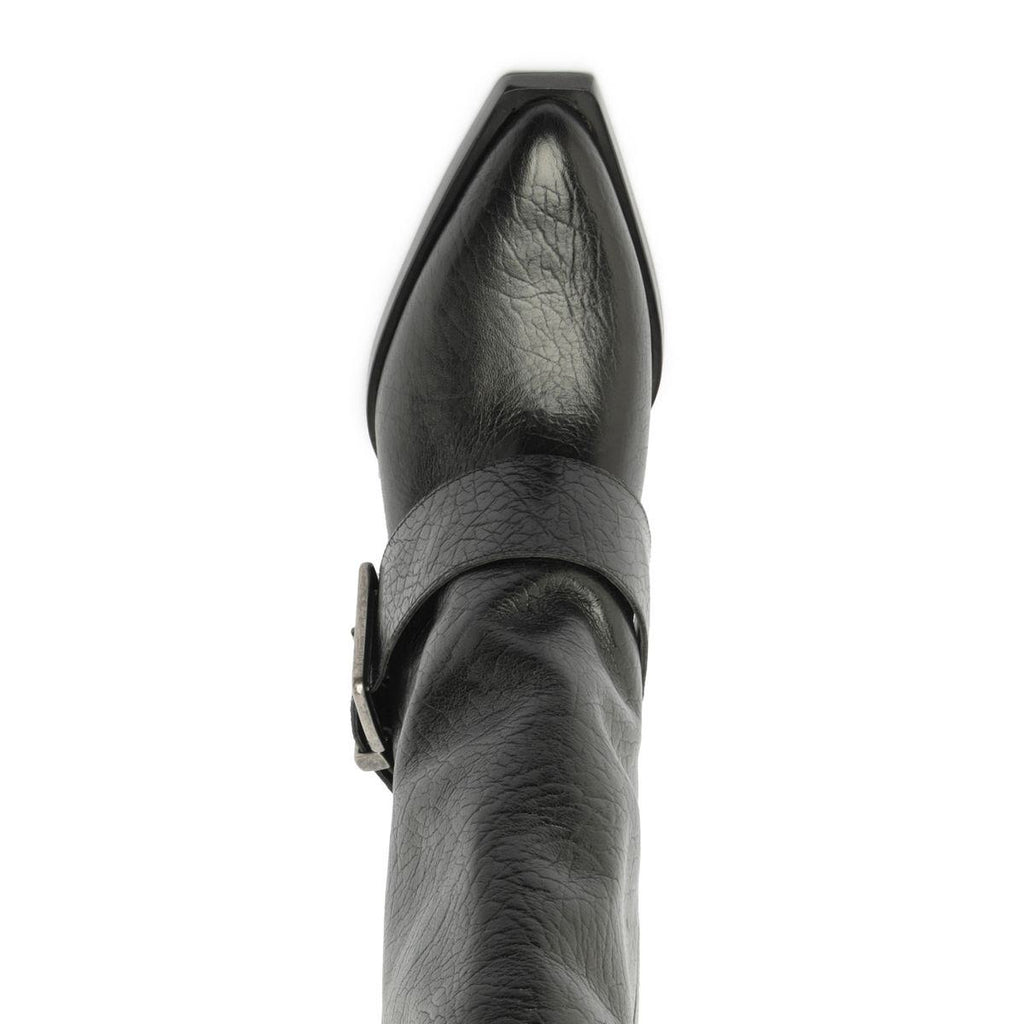 Close-up top view of Parker Up leather boot in black showcasing pointed toe and wraparound strap detail against a white background
