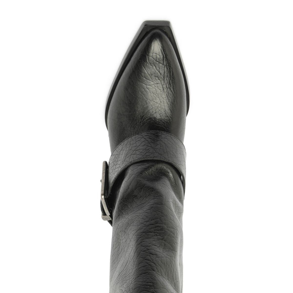 Close-up top view of Parker Up leather boot in black showcasing pointed toe and wraparound strap detail against a white background